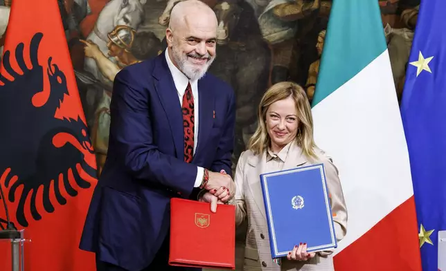 FILE - Italy's Premier Giorgia Meloni, right, and Albania's Prime Minister Edi Rama shake hands after the signing of a memorandum of understanding on migrant management centers during a meeting in Rome, Italy, on Nov. 6, 2023. (Roberto Monaldo/LaPresse via AP, File)