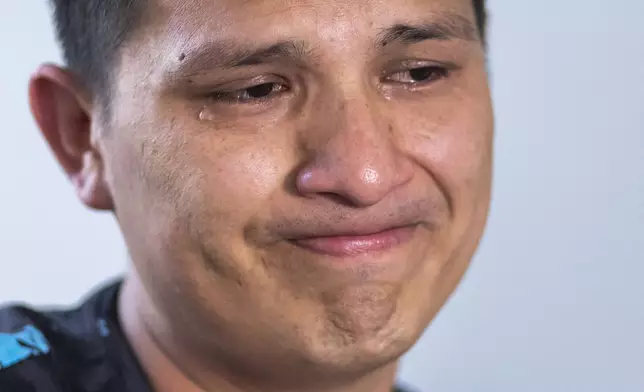 Anthony Angulo sheds tears during an interview recounting how Ecuadorean gangs had been after him for extortion money, in Bayonne, New Jersey, Tuesday, Oct. 22, 2024. (AP Photo/Eduardo Munoz Alvarez)