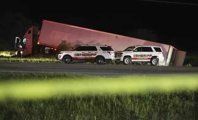 The Livingston County Sheriff’s Office works at the scene of a tractor trailer after driver Joshua Blessed was killed during a shootout with law enforcement officers on Rt. 20A in Geneseo, N.Y., on Thursday, May 28, 2020. The incident started in LeRoy, N.Y., when police stopped the tractor trailer for speeding. Blessed took off and drove into Livingston County, leading law enforcement on a chase. (Tina MacIntyre-Yee/Democrat &amp; Chronicle via AP, File)