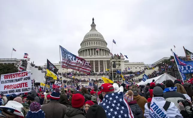 FILE - People attack the U.S. Capitol in Washington, on Jan. 6, 2021. (AP Photo/Jose Luis Magana, File)