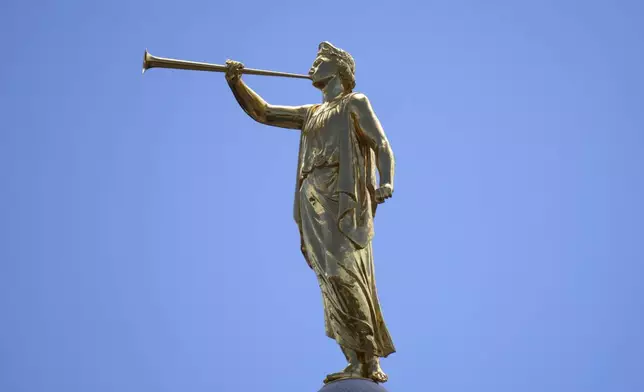 The angel Moroni statue sits atop the Salt Lake Temple of The Church of Jesus Christ of Latter-day Saints at Temple Square during an ongoing renovation project June 17, 2024, in Salt Lake City. (AP Photo/Rick Bowmer)