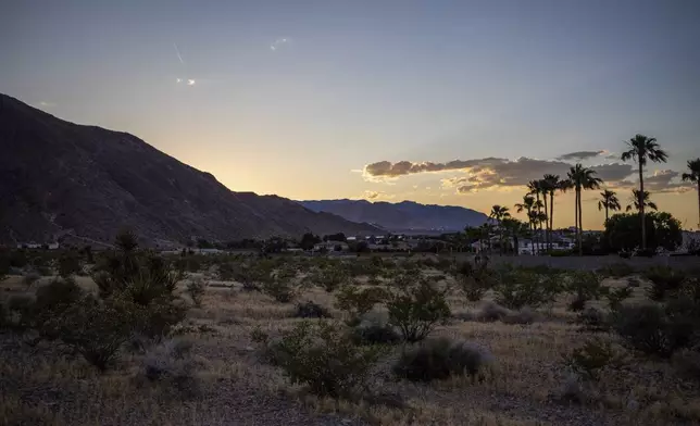 The sun sets over the site where The Church of Jesus Christ of Latter-day Saints plans to build a new temple near Las Vegas, May 13, 2024. (AP Photo/Ty ONeil)