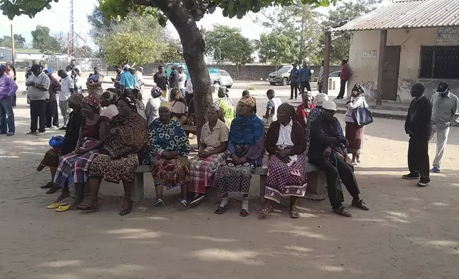 People queue to cast their votes during the general elections in Maputo, Mozambique, Wednesday, Oct. 9, 2024. (AP Photo/Charles Mangwiro)