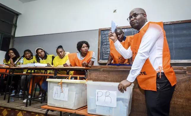 Vote counting gets underway at a polling station in Maputo, Mozambique, in general elections Wednesday, Oct. 9, 2024. (AP Photo/Carlos Uqueio)