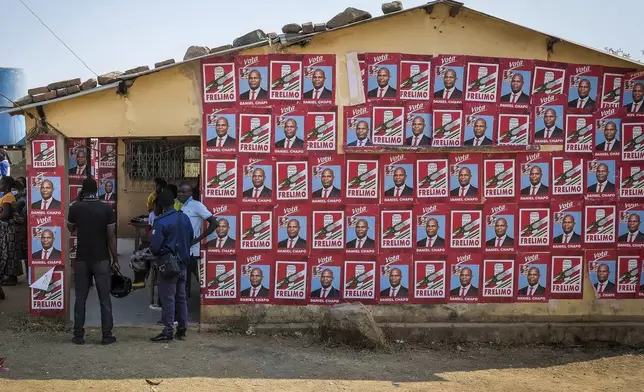 A building displays ruling party posters in support of presidential candidate Daniel Chapo ahead of elections in Maputo, Mozambique, Sunday, Oct. 6, 2024. (AP Photo/Carlos Uqueio)