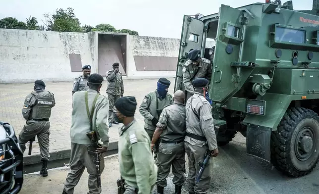 Mozambican police deploys in the streets of Maputo, Mozambique, Monday, Oct. 21, 2024, during a nationwide shutdown protest following a disputed Oct. 9 election. (AP Photo/Carlos Uqueio)