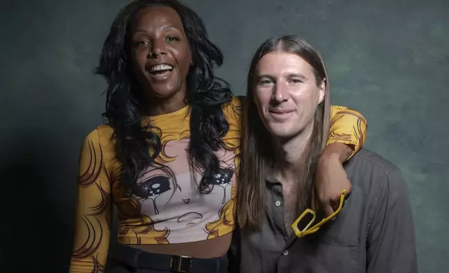 Dawn Richard, left, and Spencer Zahn pose for a portrait to promote the album "Quiet in a World Full of Noise" in Los Angeles on Thursday, Oct. 10, 2024. (AP Photo/Damian Dovarganes)