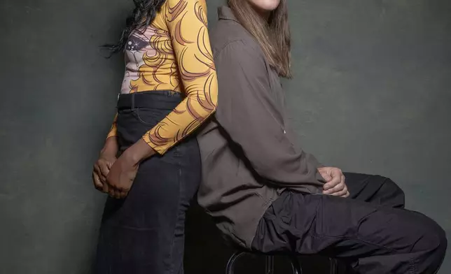 Dawn Richard, left, and Spencer Zahn pose for a portrait to promote the album "Quiet in a World Full of Noise" in Los Angeles on Thursday, Oct. 10, 2024. (AP Photo/Damian Dovarganes)