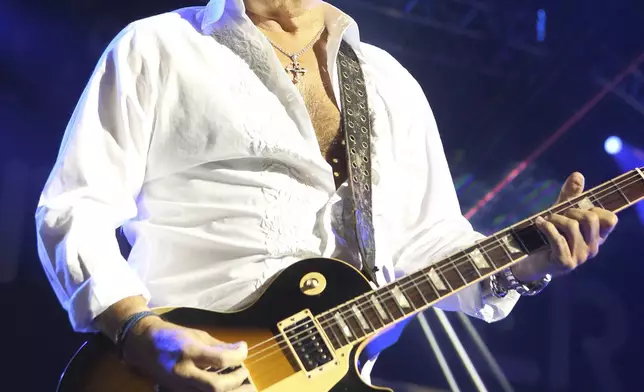 FILE - Mick Jones of the band Foreigner performs in concert during the "Soundtrack of Summer Tour 2014" in Camden, N.J., on July 3, 2014. (Photo by Owen Sweeney/Invision/AP, File)