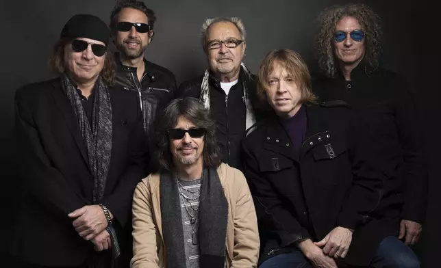 FILE - Thom Gimbel, from left, Michael Bluestein, Mick Jones, Kelly Hansen, Jeff Pilson and Bruce Watson of Foreigner pose for a portrait during the Sundance Film Festival in Park City, Utah on Jan. 20, 2017. (Photo by Taylor Jewell/Invision/AP, File)