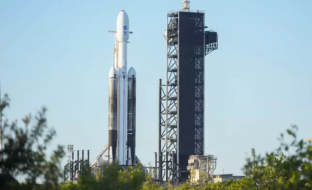 A SpaceX Falcon Heavy rocket with a NASA spacecraft bound for Jupiter stands ready for launch today on pad 39A at the Kennedy Space Center Monday, Oct. 14, 2024 in Cape Canaveral, Fla. (AP Photo/John Raoux)