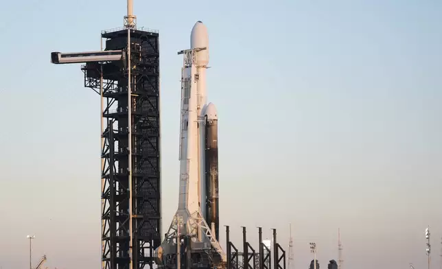 A SpaceX Falcon Heavy rocket with a NASA spacecraft bound for Jupiter stands ready for launch today on pad 39A at the Kennedy Space Center Monday, Oct. 14, 2024 in Cape Canaveral, Fla. (AP Photo/John Raoux)