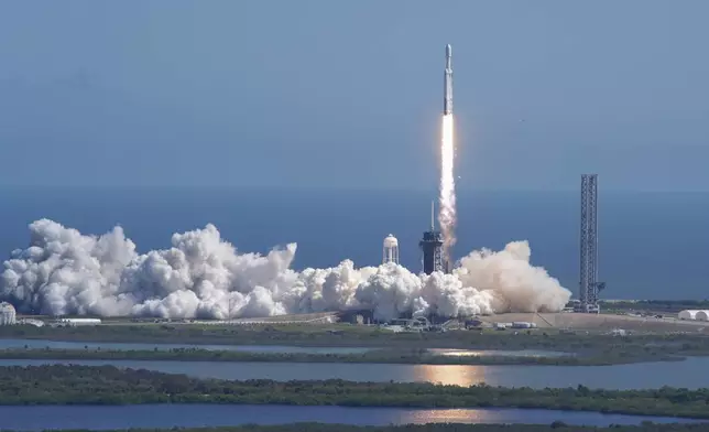 A SpaceX Falcon Heavy rocket with a NASA spacecraft bound for Jupiter lifts off from pad 39A at the Kennedy Space Center Monday, Oct. 14, 2024 in Cape Canaveral, Fla. (AP Photo/John Raoux)