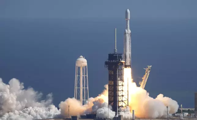 A SpaceX Falcon Heavy rocket with a NASA spacecraft bound for Jupiter lifts off from pad 39A at the Kennedy Space Center Monday, Oct. 14, 2024 in Cape Canaveral, Fla. (AP Photo/John Raoux)