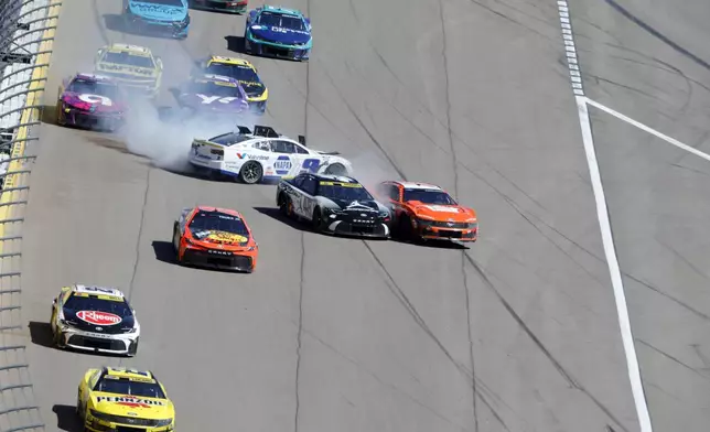 NASCAR Cup Series driver Tyler Reddick (45) crashes into Brad Keselowski (6) after colliding with Chase Elliott (9) during a NASCAR Cup Series auto race at the Las Vegas Motor Speedway Sunday, Oct. 20, 2024, in Las Vegas. (Steve Marcus/Las Vegas Sun via AP)