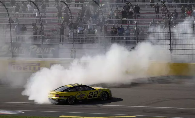 NASCAR Cup Series driver Joey Logano (22) does a burnout after winning a NASCAR Cup Series auto race Sunday, Oct. 20, 2024, in Las Vegas. (AP Photo/John Locher)