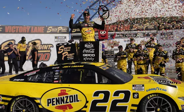 NASCAR Cup Series driver Joey Logano (22) celebrates after winning a NASCAR Cup Series auto race Sunday, Oct. 20, 2024, in Las Vegas. (AP Photo/John Locher)