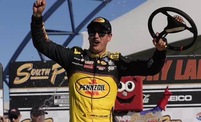 NASCAR Cup Series driver Joey Logano (22) celebrates after winning a NASCAR Cup Series auto race Sunday, Oct. 20, 2024, in Las Vegas. (AP Photo/John Locher)