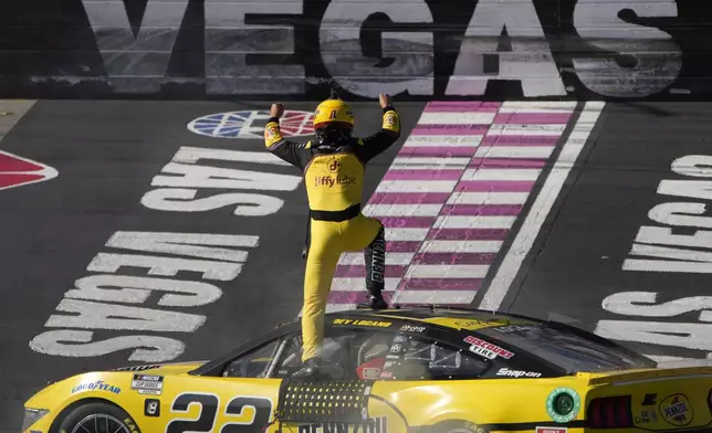 NASCAR Cup Series driver Joey Logano (22) celebrates after winning a NASCAR Cup Series auto race Sunday, Oct. 20, 2024, in Las Vegas. (AP Photo/John Locher)