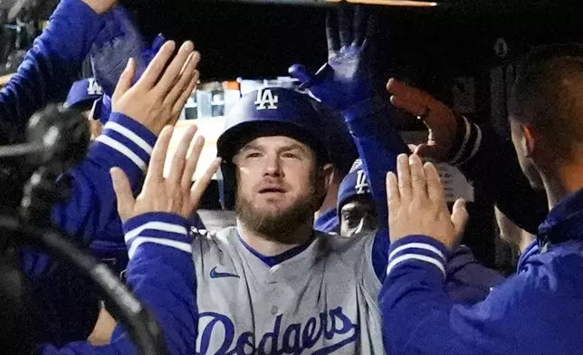 Los Angeles Dodgers' Max Muncy celebrates his home run against the New York Mets during the ninth inning in Game 3 of a baseball NL Championship Series, Wednesday, Oct. 16, 2024, in New York. (AP Photo/Ashley Landis)