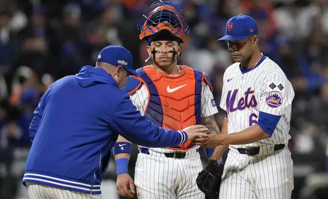 New York Mets pitcher Jose Quintana leaves the game against the Los Angeles Dodgers during the fourth inning in Game 4 of a baseball NL Championship Series, Thursday, Oct. 17, 2024, in New York. (AP Photo/Ashley Landis)