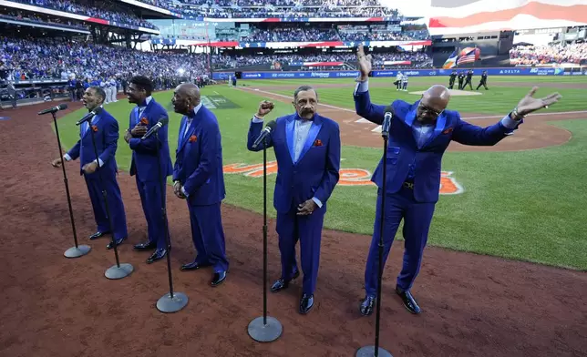 The Temptations perform before Game 5 of a baseball NL Championship Series between the Los Angeles Dodgers and the New York Mets, Friday, Oct. 18, 2024, in New York. (AP Photo/Frank Franklin II)