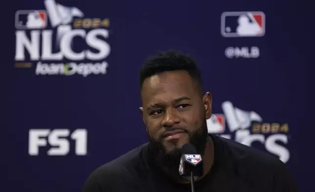 New York Mets pitcher Luis Severino talks to the media Tuesday, Oct. 15, 2024, in New York ahead of Game 3 of the baseball NL Championship Series against the Los Angeles Dodgers. (AP Photo/Adam Hunger)