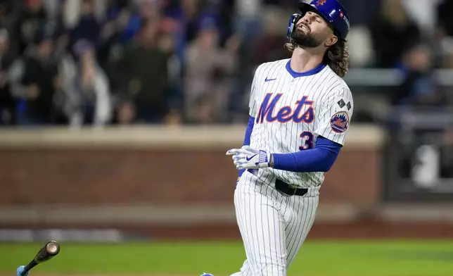 New York Mets' Jesse Winker reacts after flying out against the Los Angeles Dodgers during the sixth inning in Game 4 of a baseball NL Championship Series, Thursday, Oct. 17, 2024, in New York. (AP Photo/Ashley Landis)