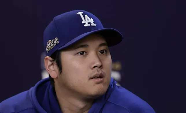 Los Angeles Dodgers' Shohei Ohtani talks to the media Tuesday, Oct. 15, 2024, in New York ahead of Game 3 of the baseball NL Championship Series against the New York Mets. (AP Photo/Adam Hunger)