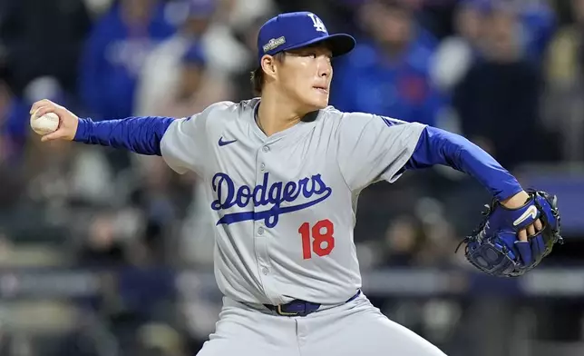 Los Angeles Dodgers pitcher Yoshinobu Yamamoto throws against the New York Mets during the first inning in Game 4 of a baseball NL Championship Series, Thursday, Oct. 17, 2024, in New York. (AP Photo/Frank Franklin II)