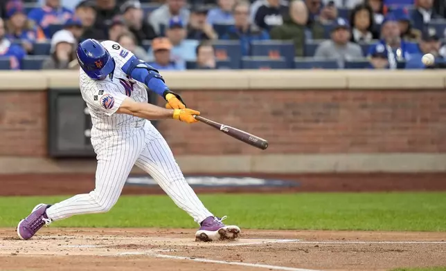 New York Mets' Pete Alonso hits a three-run home run against the Los Angeles Dodgers during the first inning in Game 5 of a baseball NL Championship Series, Friday, Oct. 18, 2024, in New York. (AP Photo/Frank Franklin II)