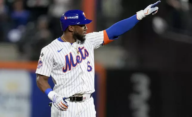 New York Mets' Starling Marte celebrates after a double against the Los Angeles Dodgers during the sixth inning in Game 5 of a baseball NL Championship Series, Friday, Oct. 18, 2024, in New York. (AP Photo/Ashley Landis)