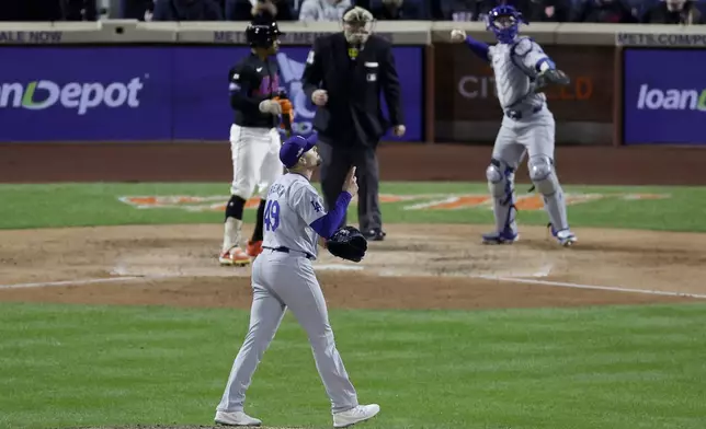 Los Angeles Dodgers pitcher Blake Treinen celebrates after striking out New York Mets' Francisco Lindor during the seventh inning in Game 3 of a baseball NL Championship Series, Wednesday, Oct. 16, 2024, in New York. (AP Photo/Adam Hunger)