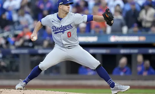 Los Angeles Dodgers pitcher Jack Flaherty throws against the New York Mets during the first inning in Game 5 of a baseball NL Championship Series, Friday, Oct. 18, 2024, in New York. (AP Photo/Ashley Landis)