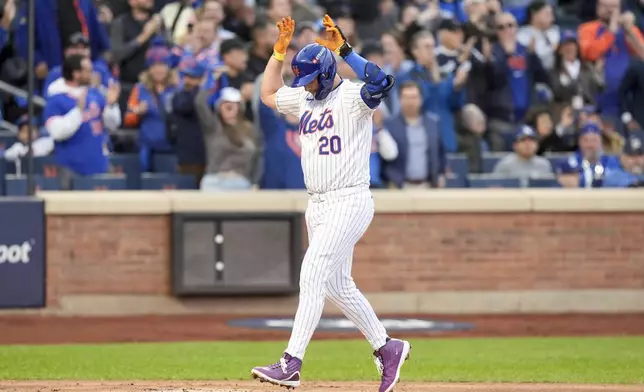 New York Mets' Pete Alonso celebrates a three-run home run against the Los Angeles Dodgers during the first inning in Game 5 of a baseball NL Championship Series, Friday, Oct. 18, 2024, in New York. (AP Photo/Frank Franklin II)