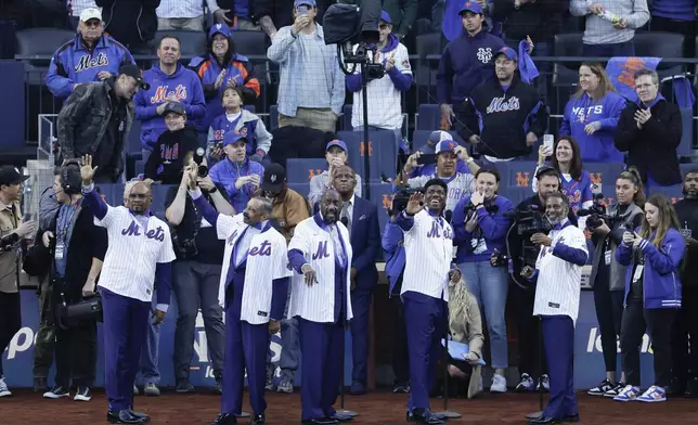 The Temptations perform before Game 5 of a baseball NL Championship Series between the Los Angeles Dodgers and the New York Mets, Friday, Oct. 18, 2024, in New York.(AP Photo/Adam Hunger)