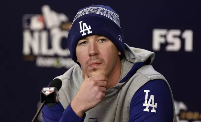 Los Angeles Dodgers pitcher Walker Buehler talks to the media Tuesday, Oct. 15, 2024, in New York ahead of Game 3 of the baseball NL Championship Series against the New York Mets. (AP Photo/Adam Hunger)