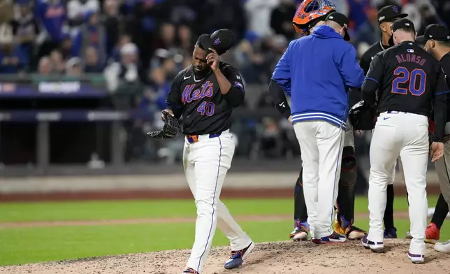 New York Mets' Luis Severino is taken out of the game against the Los Angeles Dodgers during the fifth inning in Game 3 of a baseball NL Championship Series, Wednesday, Oct. 16, 2024, in New York. (AP Photo/Ashley Landis)