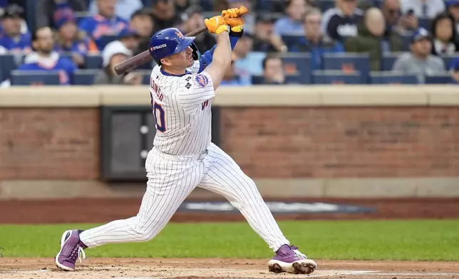 New York Mets' Pete Alonso hits a three-run home run against the Los Angeles Dodgers during the first inning in Game 5 of a baseball NL Championship Series, Friday, Oct. 18, 2024, in New York. (AP Photo/Frank Franklin II)