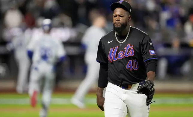 New York Mets pitcher Luis Severino walks to the dugout during the first inning in Game 3 of a baseball NL Championship Series against the Los Angeles Dodgers, Wednesday, Oct. 16, 2024, in New York. (AP Photo/Ashley Landis)