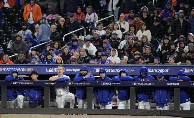 New York Mets watch during the ninth inning in Game 4 of a baseball NL Championship Series against the Los Angeles Dodgers, Thursday, Oct. 17, 2024, in New York. (AP Photo/Frank Franklin II)