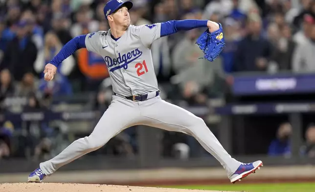 Los Angeles Dodgers pitcher Walker Buehler throws against the New York Mets during the first inning in Game 3 of a baseball NL Championship Series, Wednesday, Oct. 16, 2024, in New York. (AP Photo/Frank Franklin II)