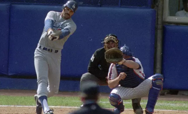 FILE - Angeles Dodger's Kirk Gibson hits a three-run homer in the fifth inning against the New York Mets during Game 5 of the National League Championship Series, Oct. 10, 1988, at Shea Stadium in New York. (AP photo/Richard Drew, File)