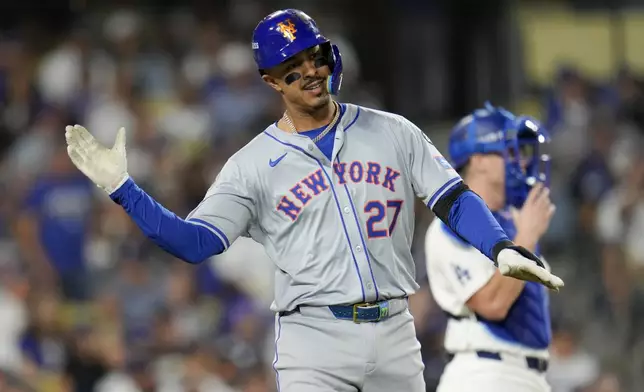 New York Mets' Mark Vientos celebrates a two-run home run during fourth inning of Game 6 in a baseball NL Championship Series against the Los Angeles Dodgers, Sunday, Oct. 20, 2024, in Los Angeles. (AP Photo/Julio Cortez)