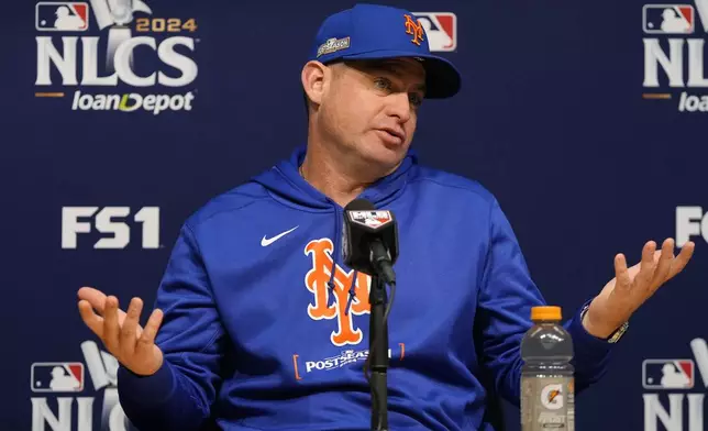 New York Mets manager Carlos Mendoza speaks during a news conference ahead of Game 6 in a baseball NL Championship Series against the Los Angeles Dodgers, Saturday, Oct. 19, 2024, in Los Angeles. (AP Photo/Mark J. Terrill)