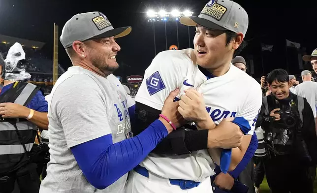 Los Angeles Dodgers' Shohei Ohtani celebrates their win against the New York Mets in Game 6 of a baseball NL Championship Series, Sunday, Oct. 20, 2024, in Los Angeles. The Dodgers will face the New York Yankees in the World Series. (AP Photo/Julio Cortez)