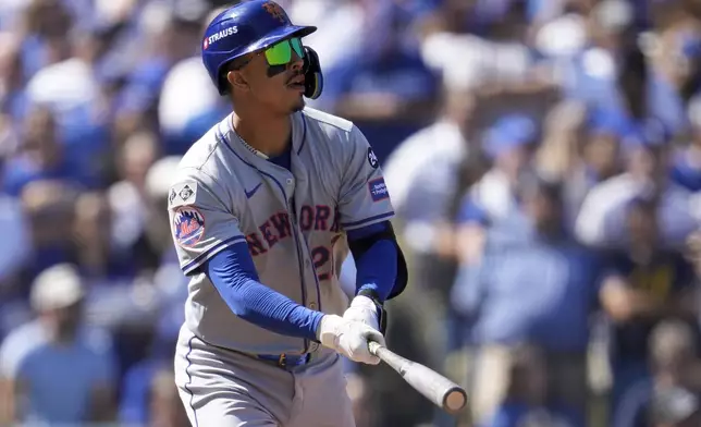 New York Mets' Mark Vientos watches his grand slam home run against the Los Angeles Dodgers during the second inning in Game 2 of a baseball NL Championship Series, Monday, Oct. 14, 2024, in Los Angeles. (AP Photo/Ashley Landis)