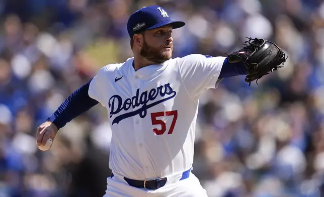 Los Angeles Dodgers pitcher Ryan Brasier throws against the New York Mets during the first inning in Game 2 of a baseball NL Championship Series, Monday, Oct. 14, 2024, in Los Angeles. (AP Photo/Gregory Bull)