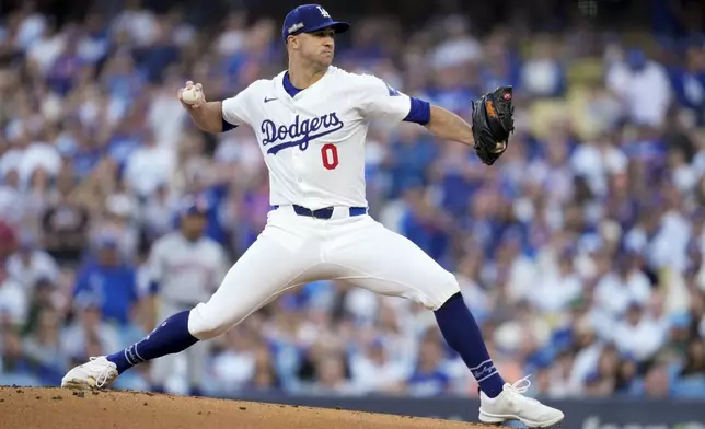 Los Angeles Dodgers pitcher Jack Flaherty throws against the New York Mets during the first inning in Game 1 of a baseball NL Championship Series, Sunday, Oct. 13, 2024, in Los Angeles. (AP Photo/Ashley Landis)