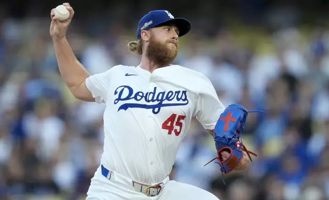 Los Angeles Dodgers pitcher Michael Kopech throws against the New York Mets during the first inning in Game 6 of a baseball NL Championship Series, Sunday, Oct. 20, 2024, in Los Angeles. (AP Photo/Ashley Landis)